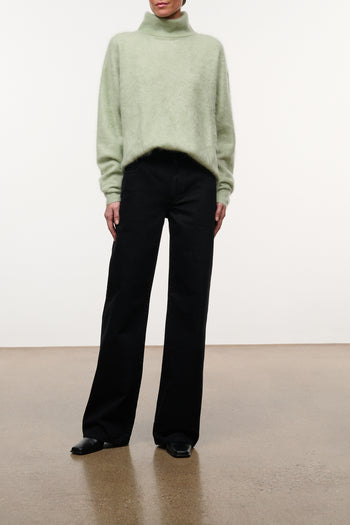 Black wide-leg jeans with button fly, belt loops, and front pockets