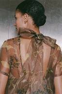 <p>Crafted from airy organza, the Calluna Dress features a sculptural high neck and a graceful scoop back, complemented by a subtle neck tie for a refined, adjustable fit.</p>