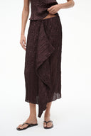 MAI textured midi skirt in dark maroon with diagonal drape and fringed hem