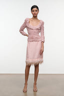Sandrose ruched mini top in pale pink with ruffle neckline, long gathered sleeves, fringe hem