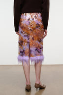 Galaxy print midi pencil skirt with lavender feathered hem, front view