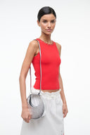 Silver crescent bag worn on the side with top handle