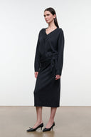 Charcoal sweater dress with V-neck, long sleeves, and tied waist, midi length