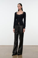 Black cashmere sweater with button front and long sleeves, hip-length hem