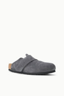 A single gray suede clog shoe with a black sole and a small tan cork heel insert, shown from a side profile on a clean white background.