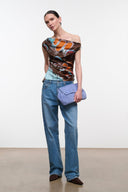 Silk one-shoulder top with draped neckline, brown orange turquoise butterfly print, side view