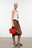 Maude mini tote bag in tangelo orange, small structured design with top handles.