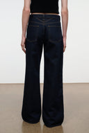 GUS relaxed jeans in dark indigo, back view with patch pockets and wide straight hem