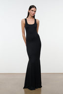 Black sleeveless maxi dress with scoop neck and thin straps, fitted body to long hem