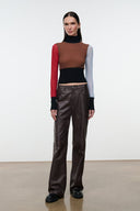 Mock-neck color-block long-sleeve top with black waistband panel and red/blue sleeves