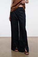 Black wide-leg pants with side slit and hip pocket detail