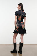 Black silk dress with short sleeves, scoop neck, tapestry bird print, ruffled hem