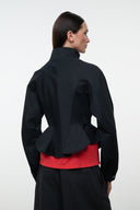 Black jacket back view with stand collar and curved peplum hem