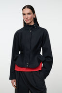 Black stand-collar jacket with snap front and peplum waist detail