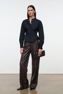 Black button-front top with stand collar, long sleeves, peplum waist detail