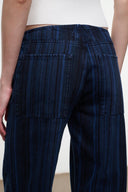 Women's dark navy striped wide-leg jeans, front view with patch pockets and stitched seams