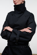 Black high-neck jacket with snap buttons, wide cuffs, and belted waist strap