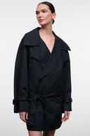 Black belted jacket with notched lapels, front button closures, and flap pockets