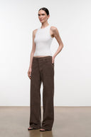 Relaxed wide-leg dark brown corduroy jeans with front patch pockets and button closure