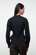 Black back view of button-front top with long sleeves and peplum waist