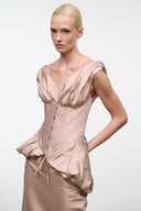 Light rose silk dress with cap sleeves, V neckline, and ruched peplum waist
