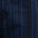 Close-up of dark navy striped denim fabric with vertical and subtle stitched texture