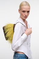 Yellow fringe mini bag with dark beaded trim and top handle, espresso brown accents.