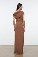 Women's draped one-shoulder maxi dress in warm brown, back view with diagonal drape.