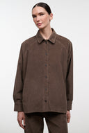 Brown corduroy shirt jacket with long sleeves and buttoned front