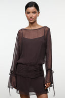 Dark brown sheer long-sleeve mini dress with gathered ruched waist and tie-cuff sleeves.