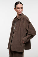 Brown corduroy shirt jacket with pointed collar and side flap pocket