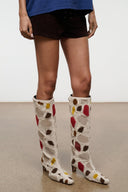 Pair of tall suede patchwork boots, cream with red and yellow accents and low heel