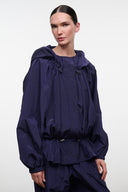 Hooded windbreaker jacket in dark purple with gathered waist and elastic cuffs