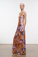 Sleeveless maxi dress with long skirt; orange and purple abstract watercolor print.
