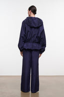 FLO pants in dark navy with wide legs, back view showing elastic waistband