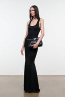Black snake-textured cuff clutch with silver bar closure, held low at front