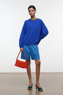 Haskell blue shorts with yellow side stripe and elastic waistband, front pocket and logo.