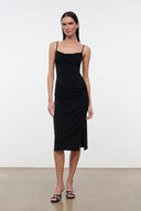 Black draped midi dress with spaghetti straps and cowl neckline