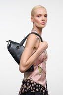 Black mini shoulder bag with short shoulder strap and metal ring hardware