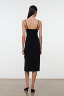Black low-back midi dress with spaghetti straps and gathered drape