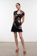 Black silk mini dress with short sleeves and colorful floral bird print, flared hem