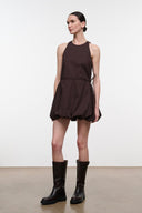 Dark brown sleeveless mini dress, side view, gathered waist and tied side seam
