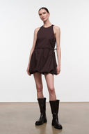 Dark brown sleeveless mini dress with pleated puff skirt and drawstring waist ties