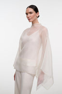 Ivory sheer overlay top with high neckline and draped cape sleeves