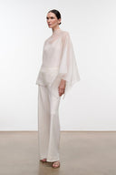 Ivory high-neck top with draped sleeves and straight fit