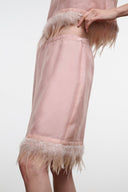 Light pink satin skirt with feather fringe hem and side seam detail