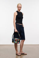 Beaded crossbody bag with multicolor geometric dots and black handle