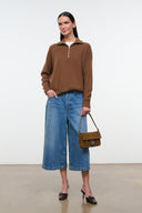 Cigar-brown suede handbag on shoulder strap with fringe trim and buckle clasp