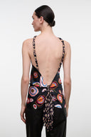 Silk halter top with multicolor circular print, open back and crisscross straps