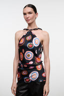 Silk halter top with multicolor circular print on black, sleeveless keyhole